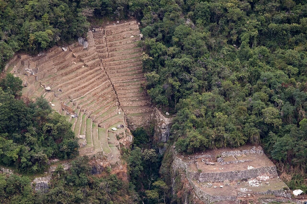 The terraces of Machu Picchu seen from the slope of Putucusi, across the valley.