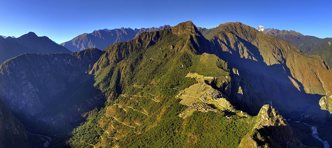 A wide view of the Machu Picchu citadel and its terraces, taken from Huayna Picchu.